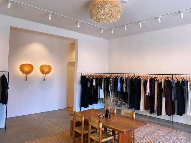 Track lighting and wall sconces in a clothing store